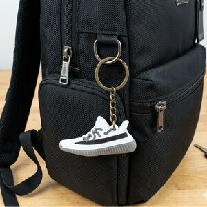 Adidas Keychain with Gray and White Design